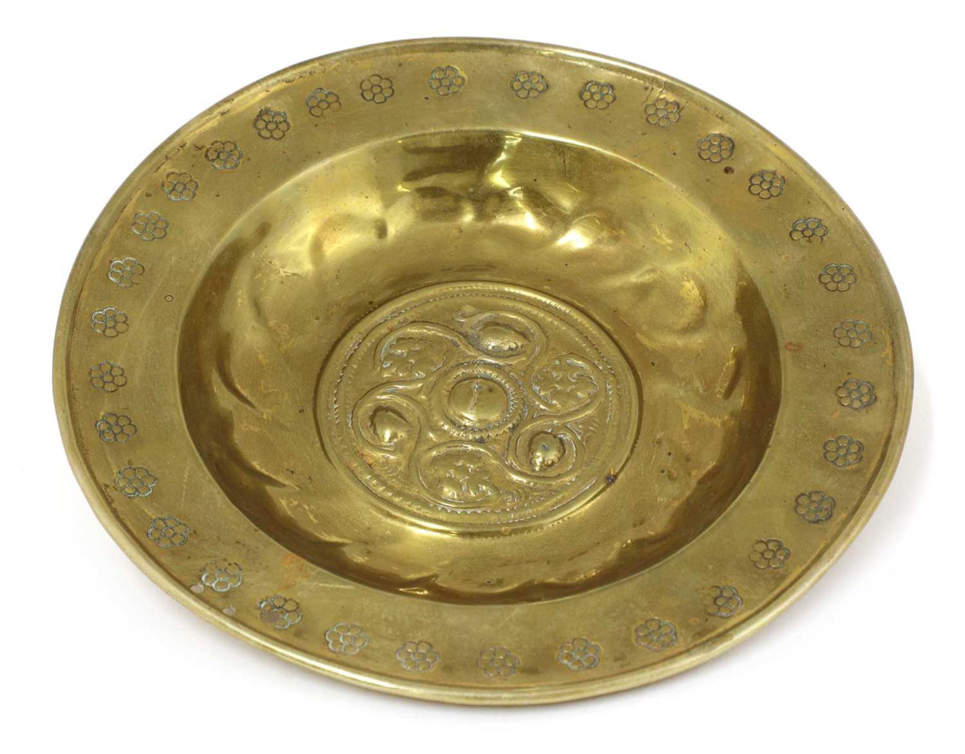 A small brass alms dish