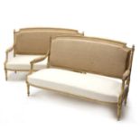 A pair of French Louis XVI-style painted and parcel-gilt settees