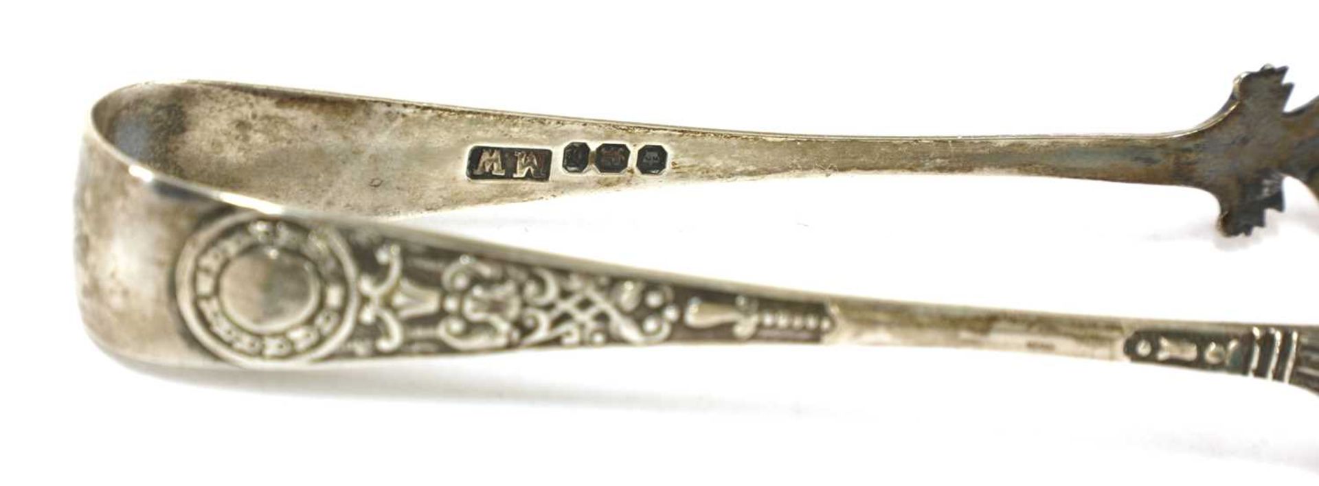 A pair of George III silver sugar tongs, - Image 28 of 28