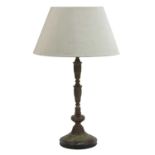 A patinated metal table lamp and shade,