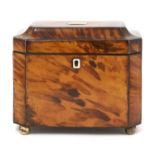 A tortoiseshell tea caddy,