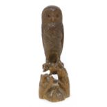 A Black Forest carved softwood owl,