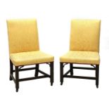 A pair of Chippendale period single library chairs