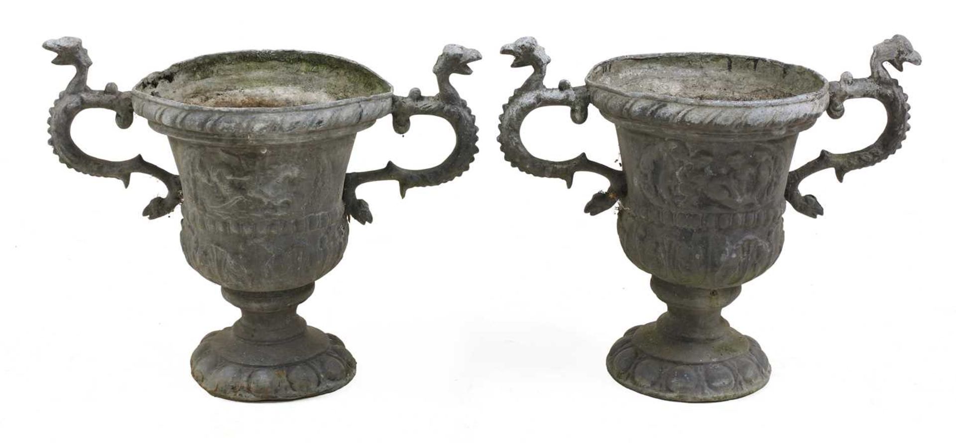 A pair of twin-handled lead urns,