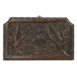 A primitive carved oak panel,