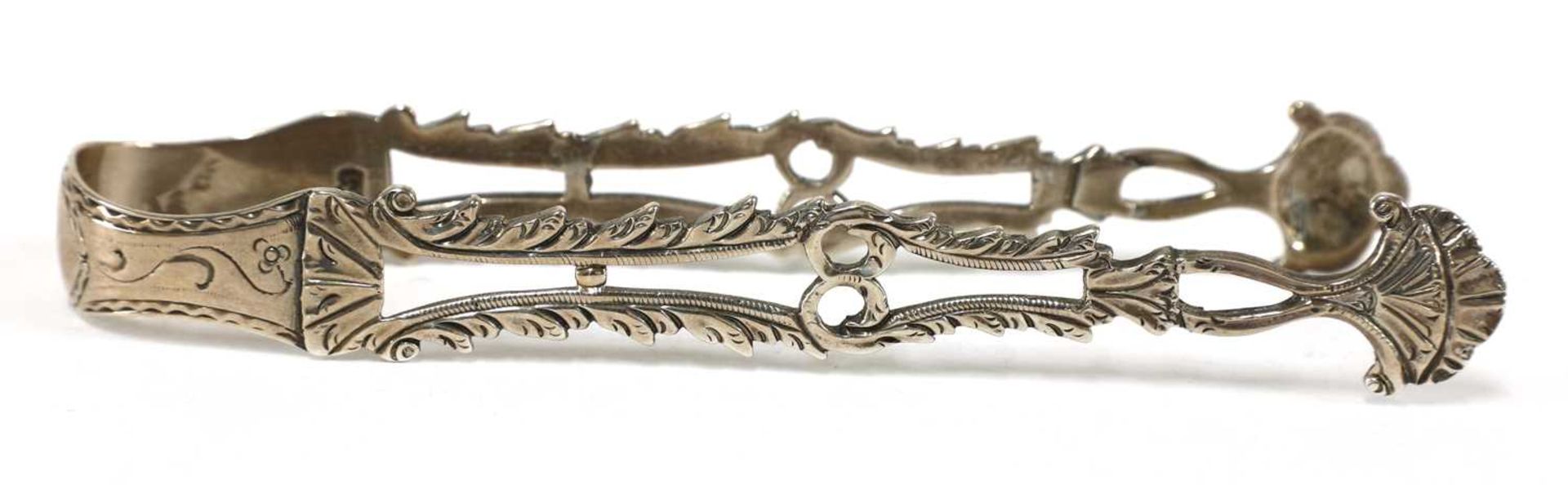 A pair of George III silver sugar tongs, - Image 13 of 28