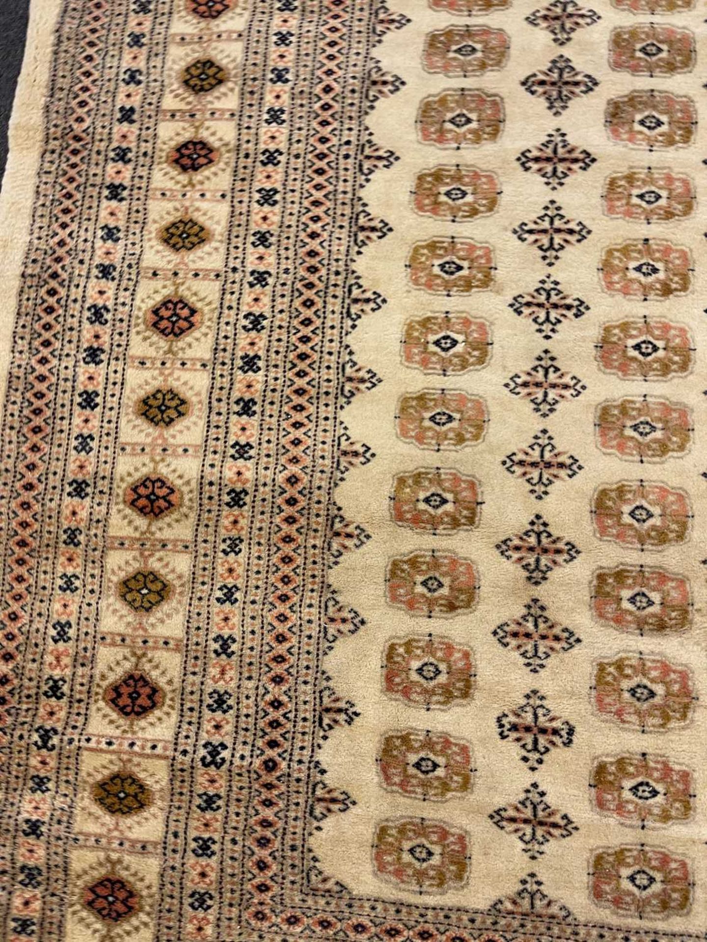 A Bokhara design carpet, - Image 8 of 13