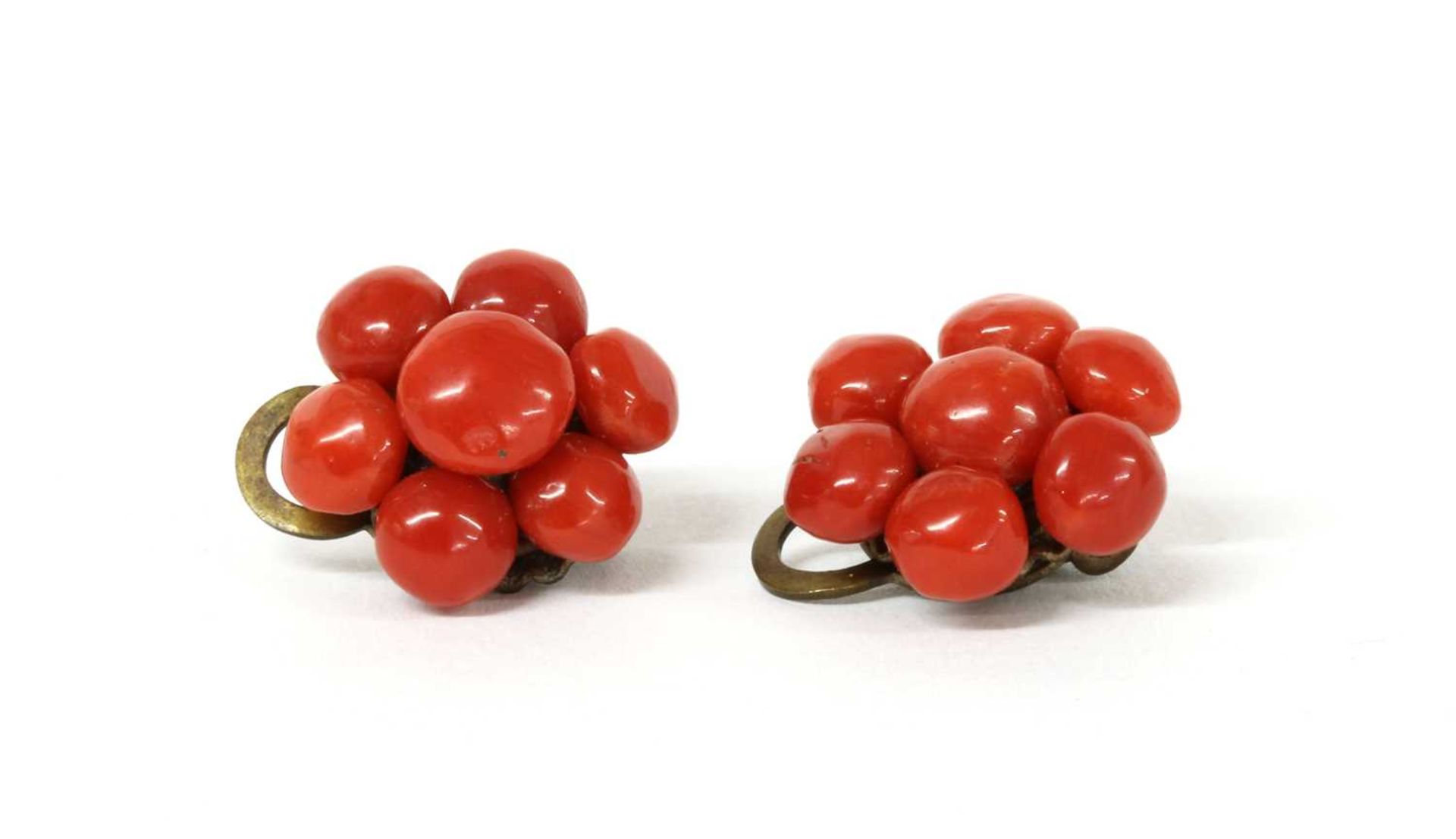 A pair of metal coral cabochon cluster earrings,