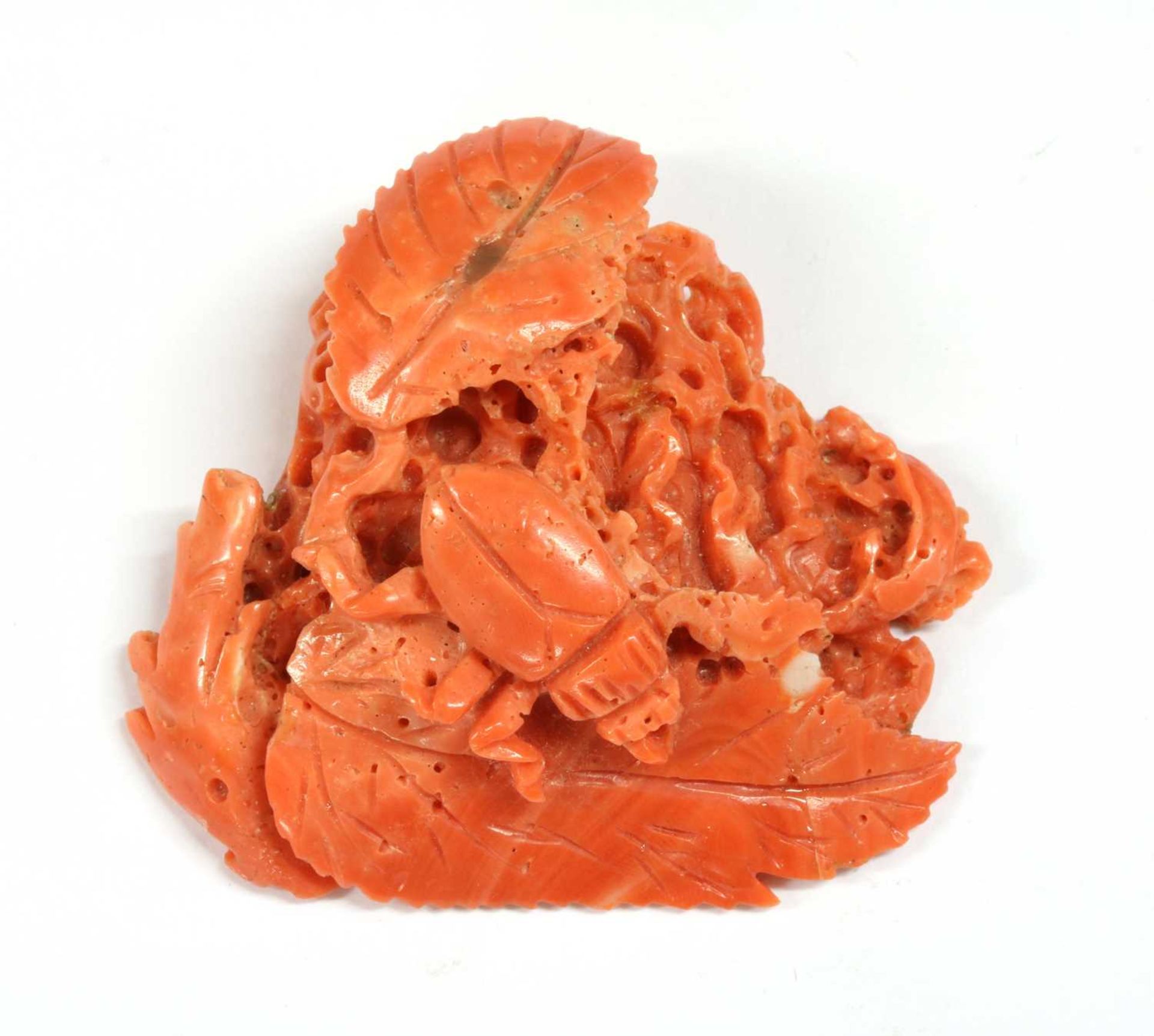 An unmounted carved coral,