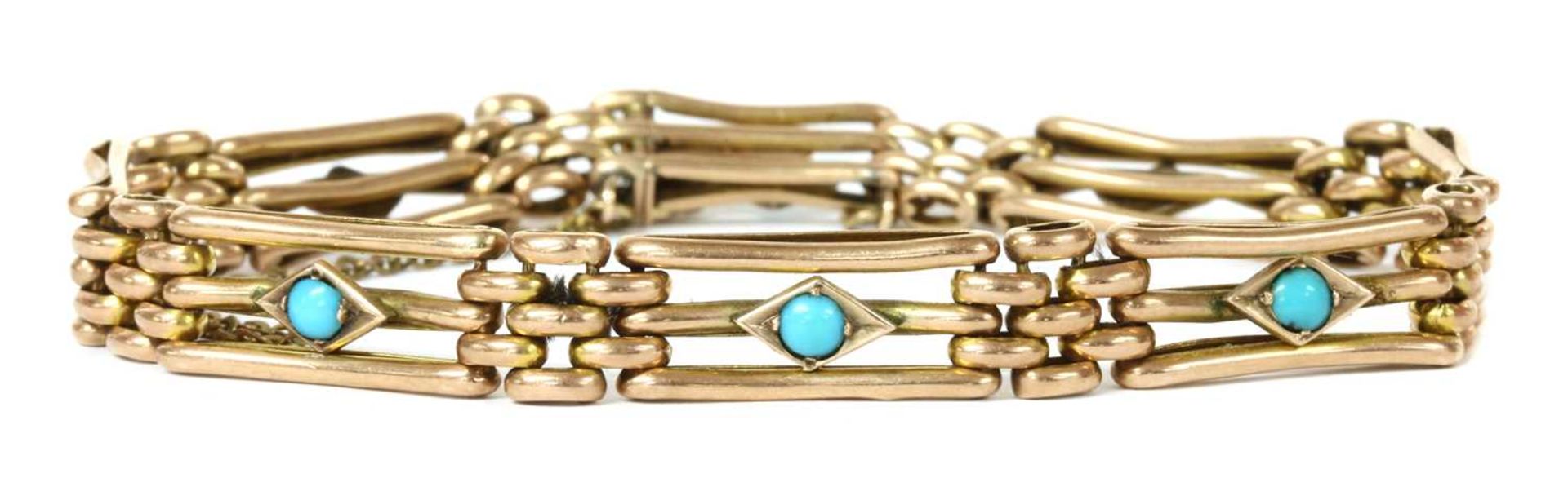 An Edwardian gold turquoise set gate bracelet,