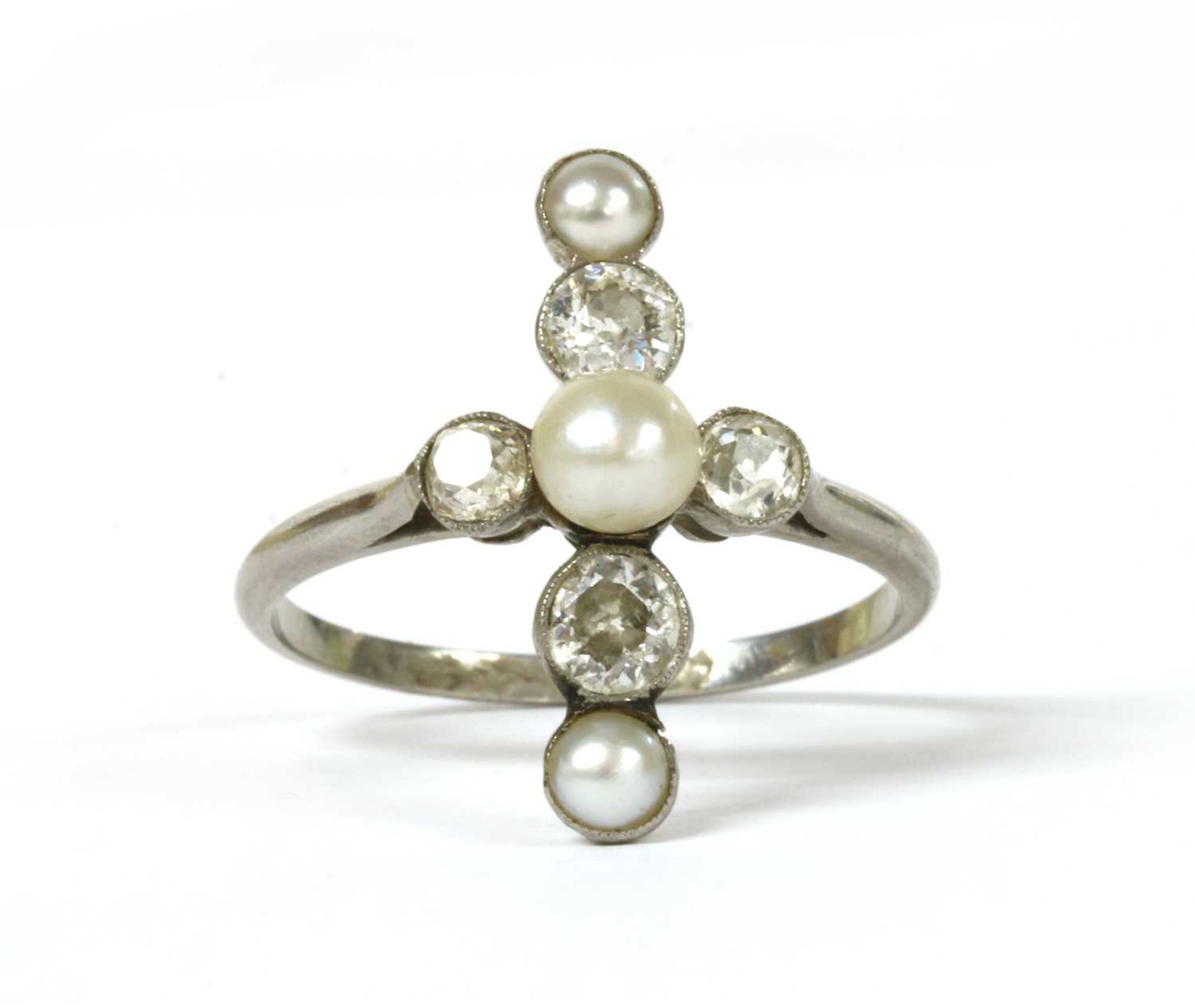 A platinum pearl and diamond ring,