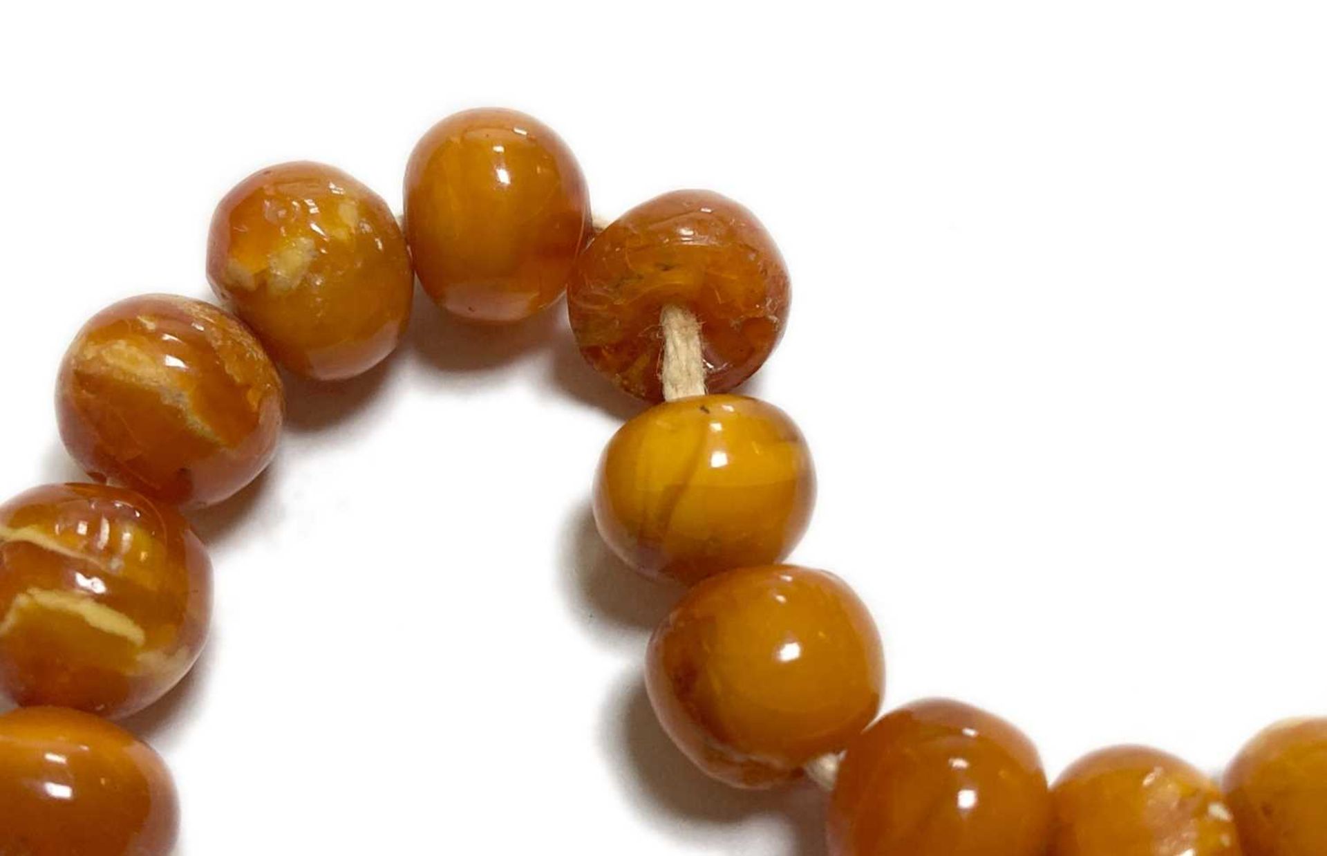 A single row slightly graduated butterscotch amber prayer bead necklace, - Image 7 of 15
