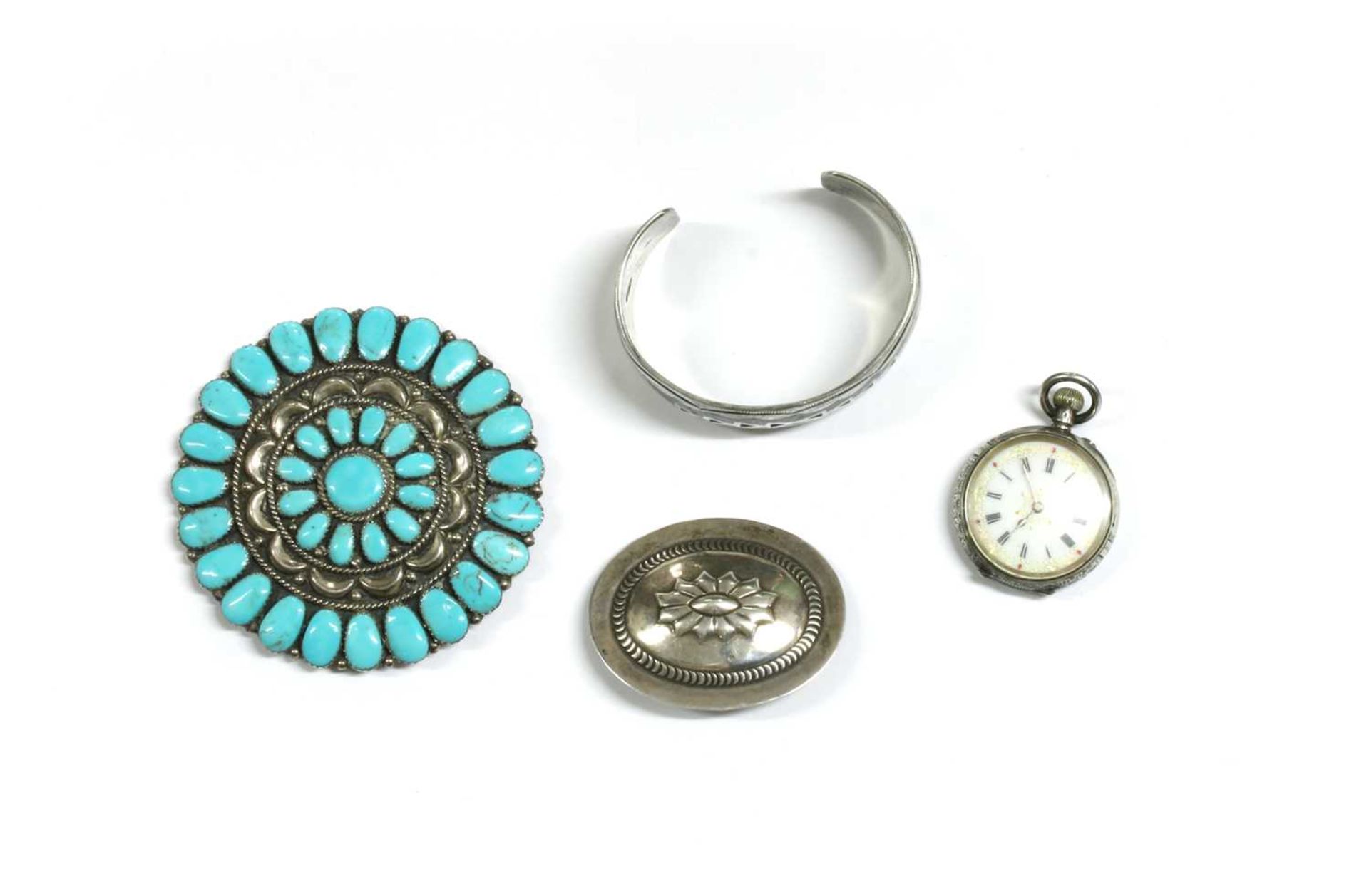 A Navajo silver turquoise brooch,