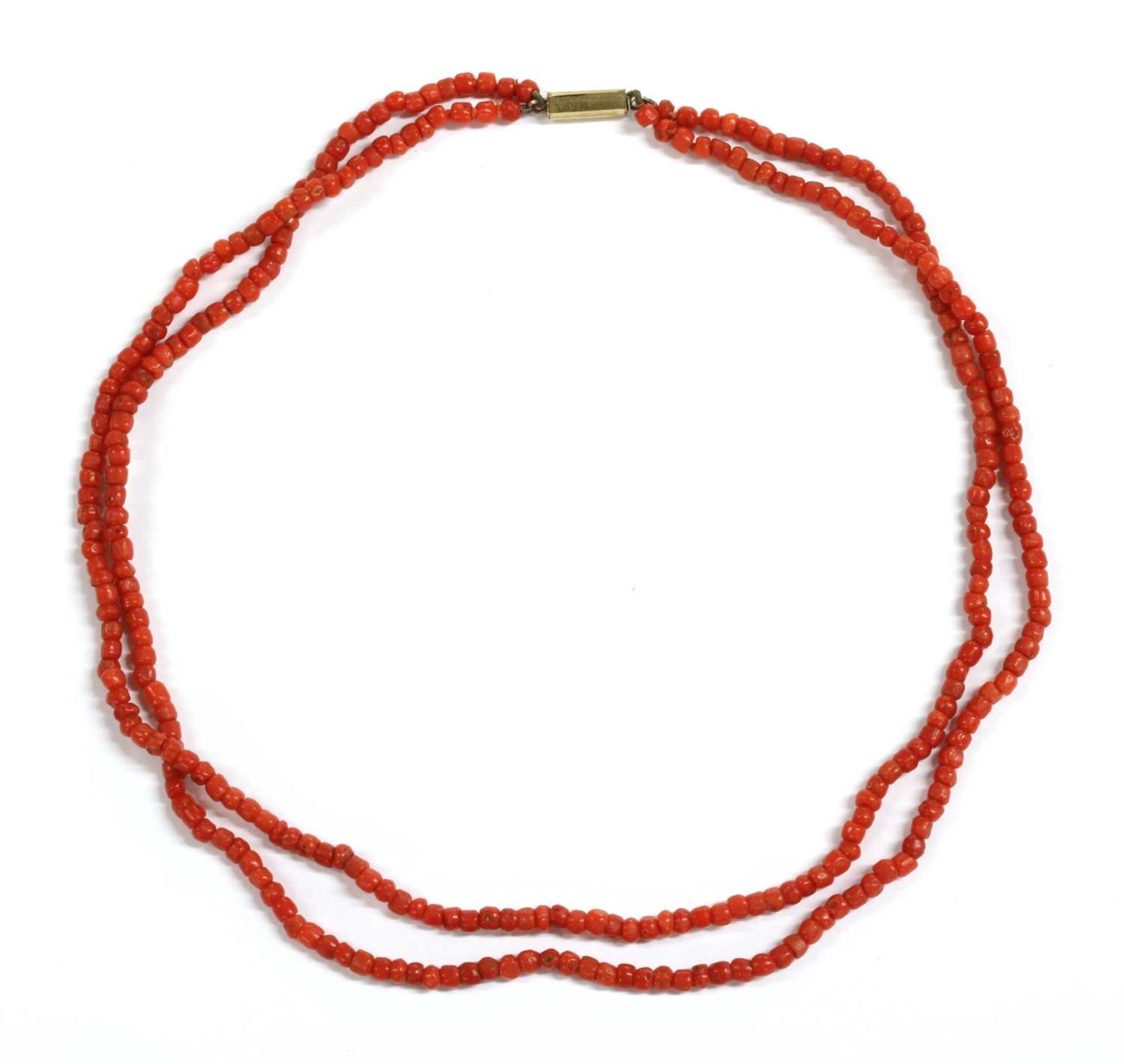A two row barrel shaped coral bead necklace,