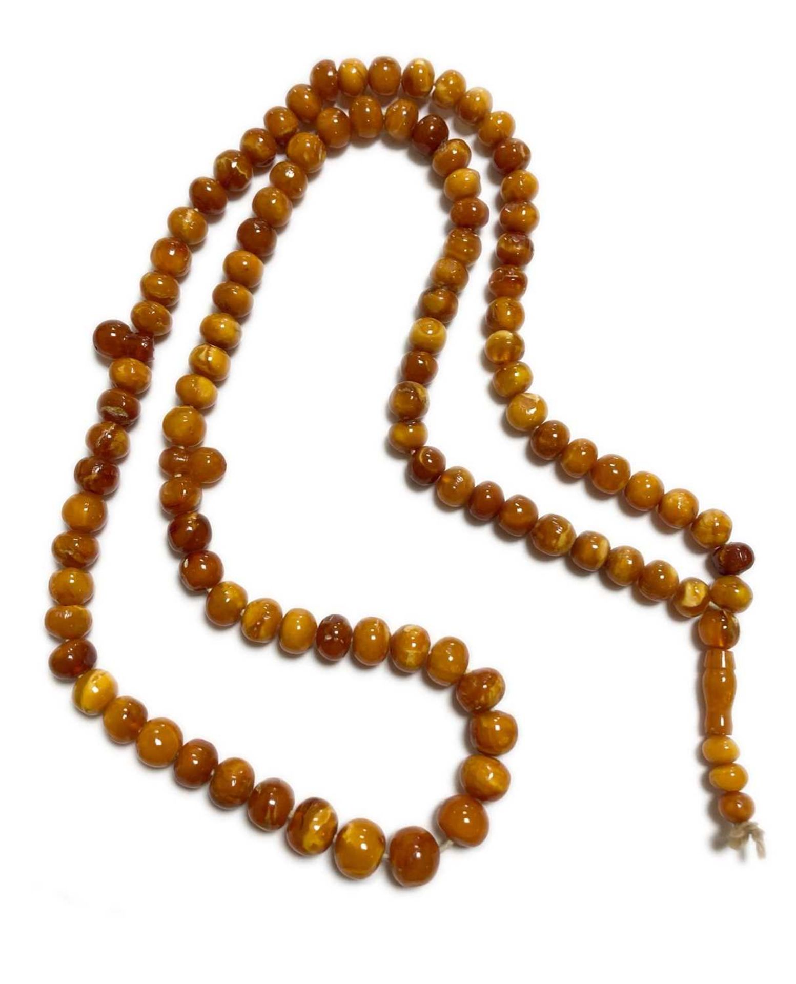 A single row slightly graduated butterscotch amber prayer bead necklace, - Image 2 of 15