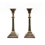 A pair of silver candlesticks,