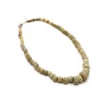 A string of Phoenician stone and glass beads,