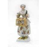 A Meissen porcelain figure of a trinket seller