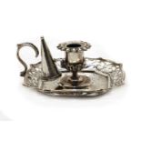 A Victorian silver candlestick and snuffer,