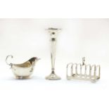 A modern silver six division toast rack by Elkington & Co,
