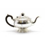 A silver teapot,