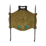 An Arts and Crafts copper and steel-mounted fire screen,