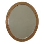 An oval bevelled panel wall mirror,