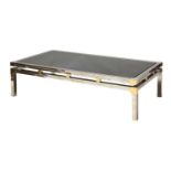 A chrome and brass coffee table,