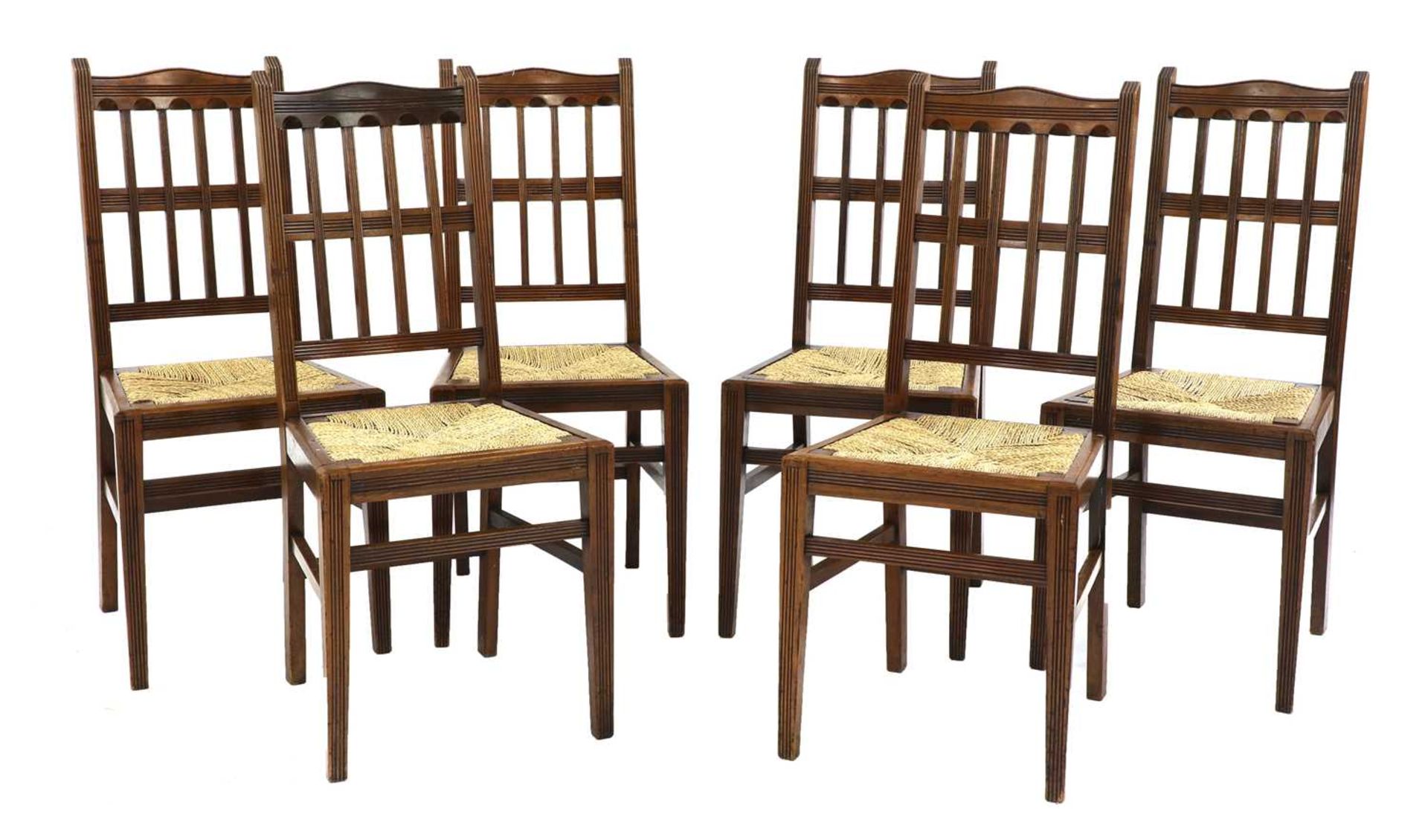 A set of six walnut dining chairs,