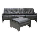 A black three-seater leather sofa,