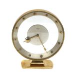 A Kienzle polished brass clock,
