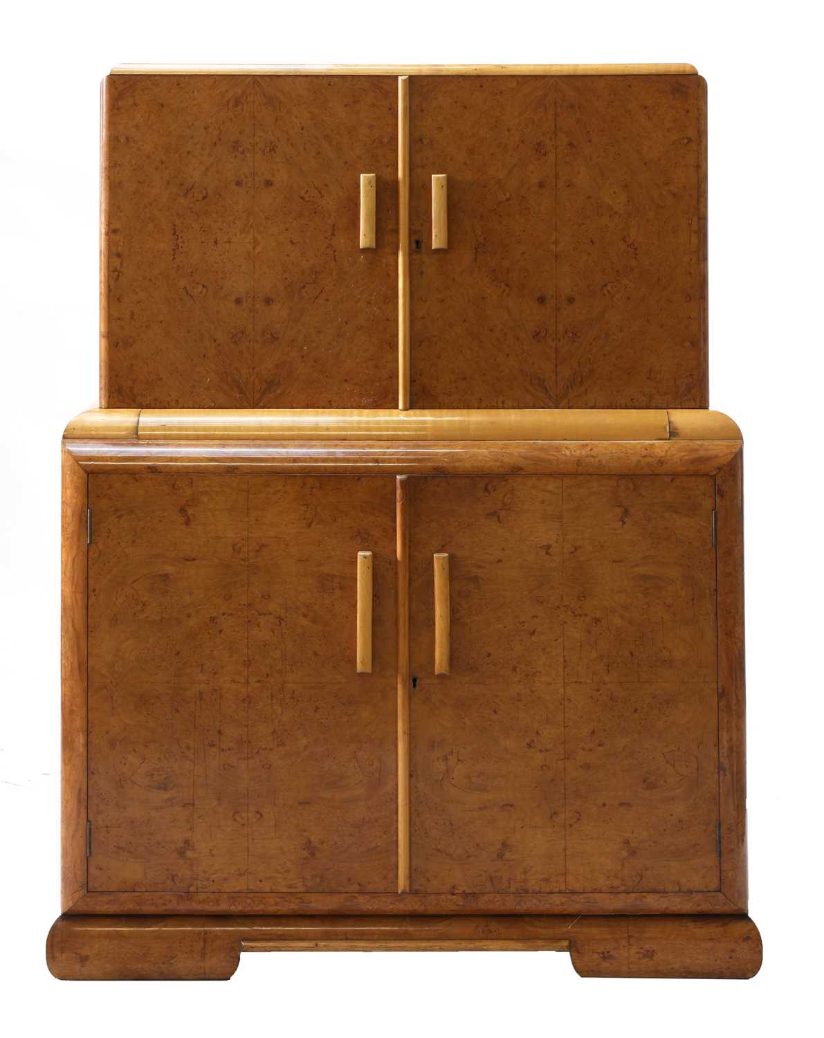 An Art Deco burr walnut and maple cocktail cabinet,