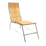 A laminated wood chaise lounge,