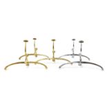 A collection of five brass and chrome coat hangers,