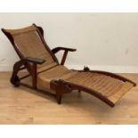 A reclining steamer chair,