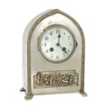 An Arts and Crafts silvered mantel clock,