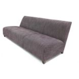A contemporary purple upholstered settee,