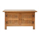An Arts and Crafts oak sideboard,