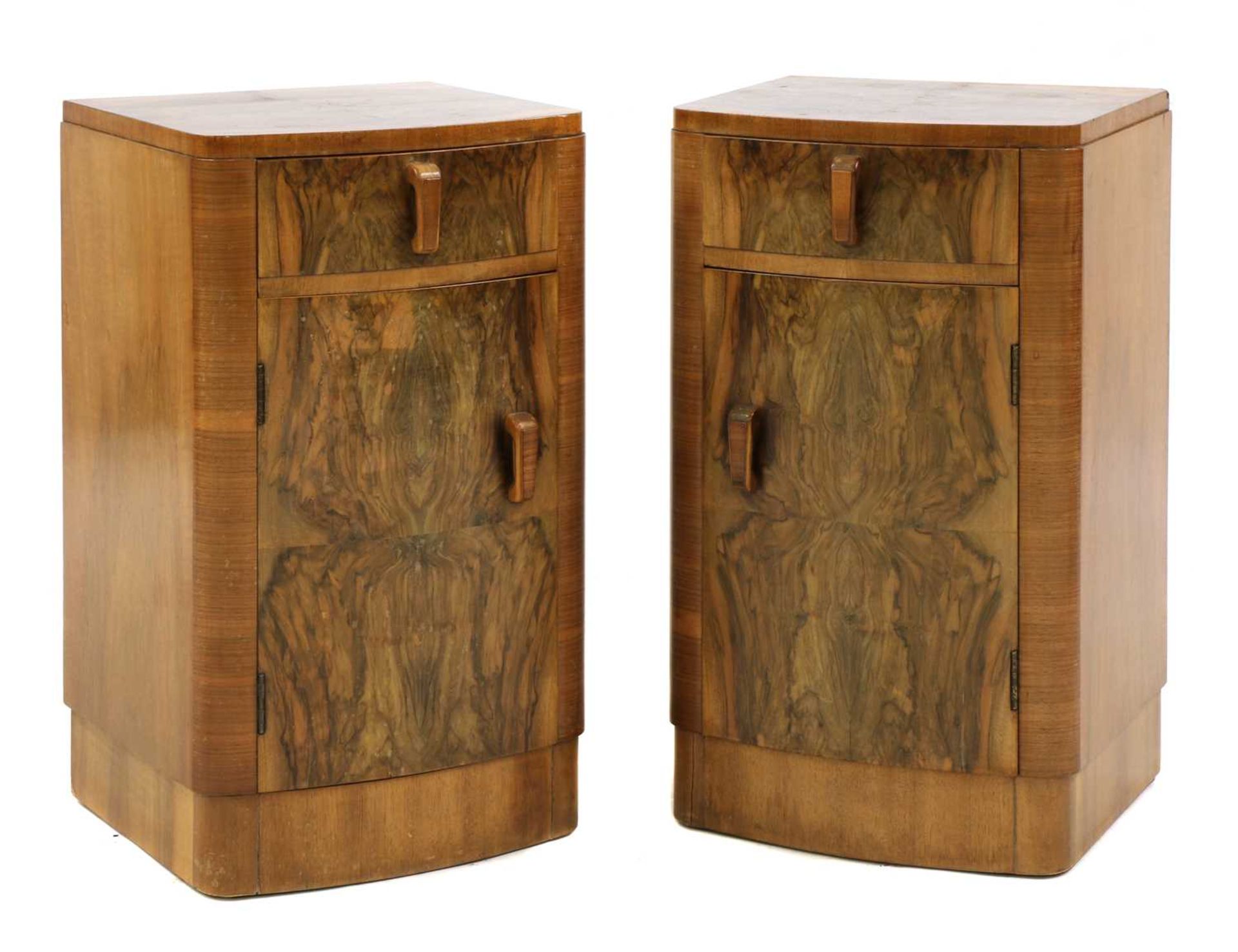 A pair of Art Deco walnut bedside cabinets,