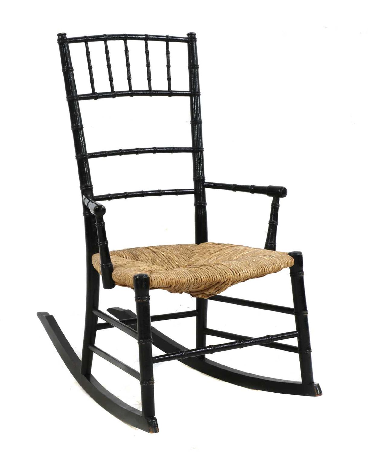 An Aesthetic ebonised child's rocking chair,