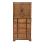 A Gordon Russell oak two-part cabinet and chest,