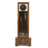 An Art Deco walnut longcase clock,