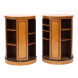 A pair of maple veneered revolving bookcases,