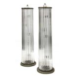 A pair of glass standard lamps,