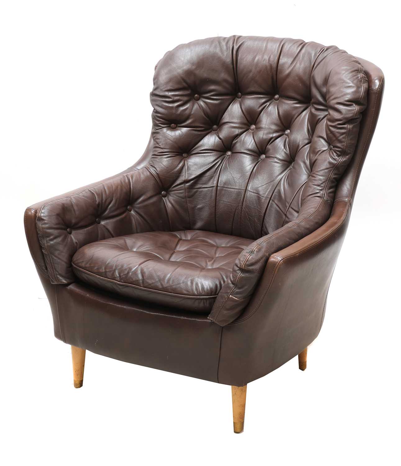 A Danish leather button back armchair,