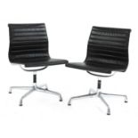 A pair of Eames 'EA105' chairs,