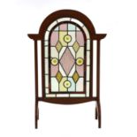 An Arts and Crafts mahogany fire screen,