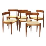 A set of six teak dining chairs,