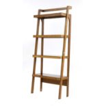 A set of contemporary walnut tapering shelves,