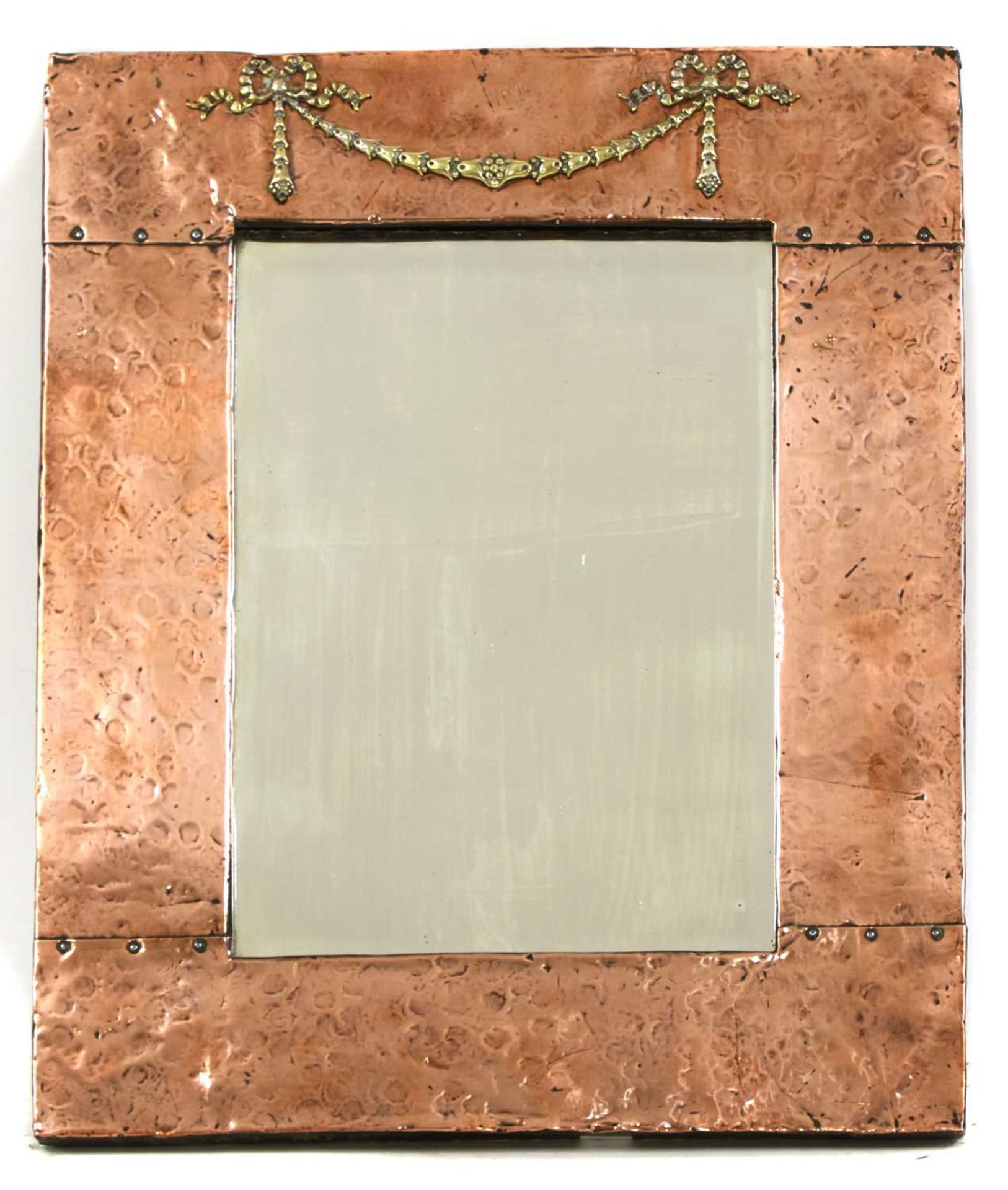 An Arts and Crafts copper mirror,